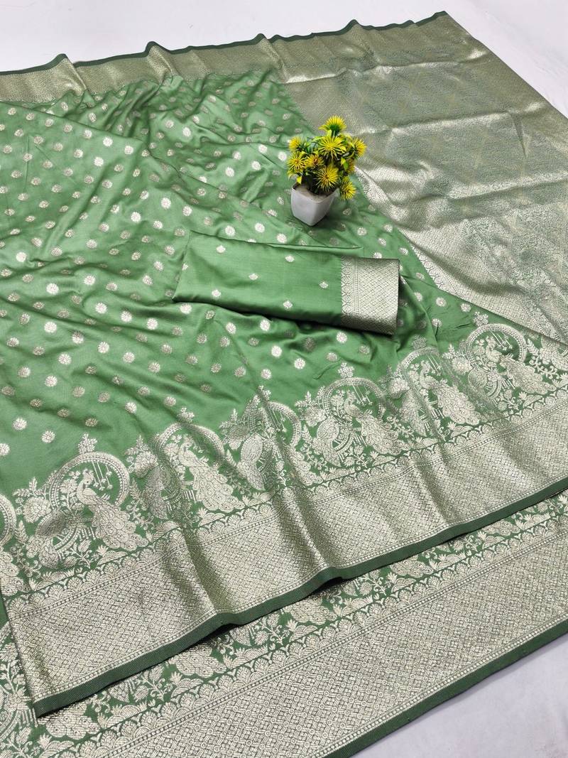 Light green zari woven banarasi silk blend traditional saree with blouse piece