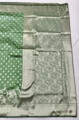 Light green zari woven silk blend traditional saree with blouse piece