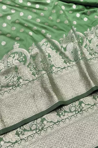 Light green zari woven silk blend traditional saree with blouse piece