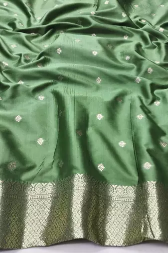 Light green zari woven silk blend traditional saree with blouse piece