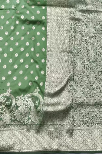 Light green zari woven silk blend traditional saree with blouse piece