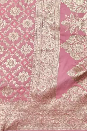 Pink zari woven silk blend traditional saree with blouse piece