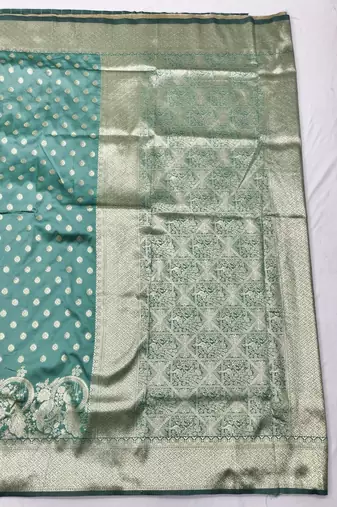 Green zari woven silk blend traditional saree with blouse piece