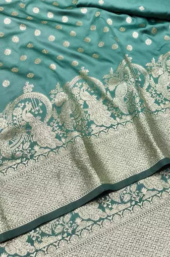 Green zari woven silk blend traditional saree with blouse piece