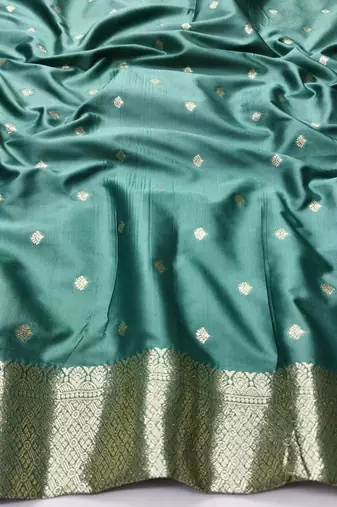 Green zari woven silk blend traditional saree with blouse piece