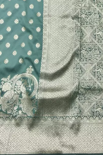 Green zari woven silk blend traditional saree with blouse piece