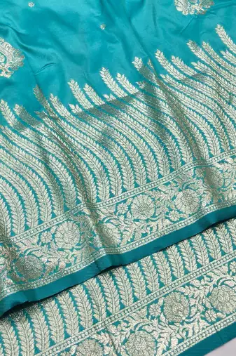 Blue zari woven silk blend traditional saree with blouse piece