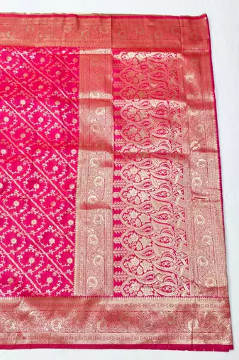 Rani pink zari woven silk blend traditional saree with blouse piece