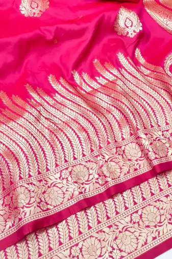 Rani pink zari woven silk blend traditional saree with blouse piece