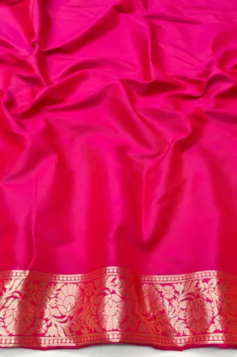 Rani pink zari woven silk blend traditional saree with blouse piece