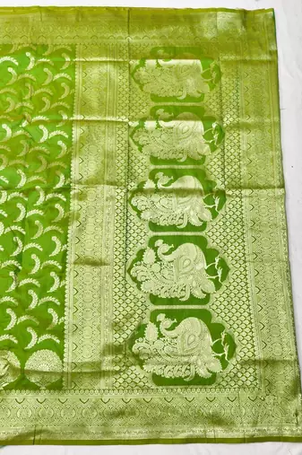 Green zari woven silk blend traditional saree with blouse piece