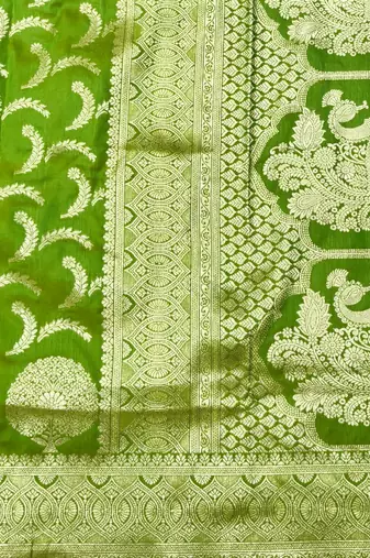 Green zari woven silk blend traditional saree with blouse piece