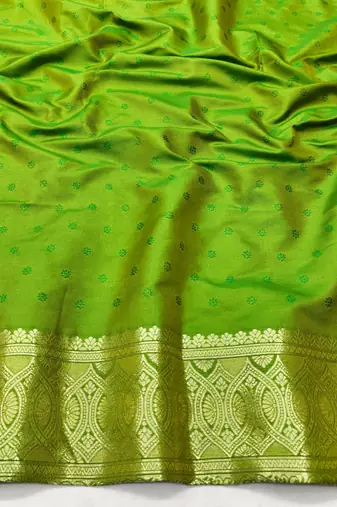 Green zari woven silk blend traditional saree with blouse piece