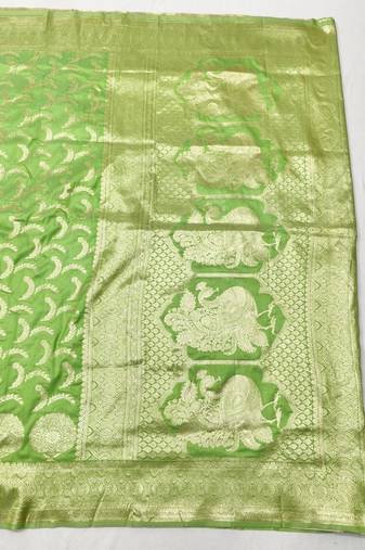 Light green zari woven silk blend traditional saree with blouse piece