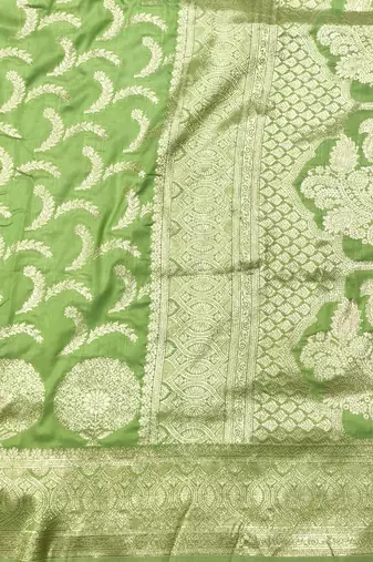 Light green zari woven silk blend traditional saree with blouse piece