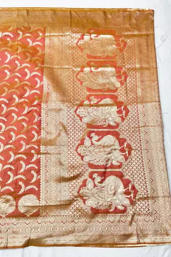 Orange zari woven silk blend traditional saree with blouse piece