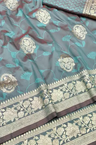 Light blue zari woven silk blend traditional saree with blouse piece