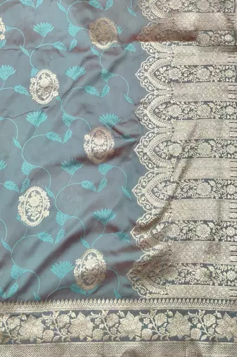 Light blue zari woven silk blend traditional saree with blouse piece