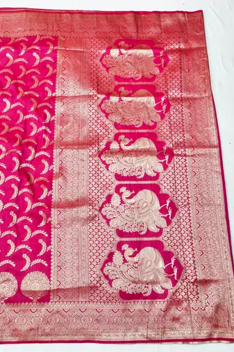 Rani pink zari woven silk blend traditional saree with blouse piece