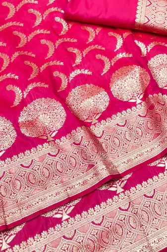 Rani pink zari woven silk blend traditional saree with blouse piece