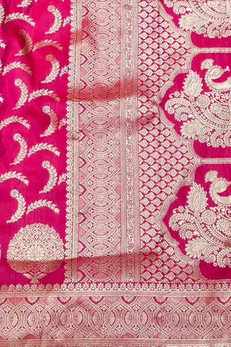 Rani pink zari woven silk blend traditional saree with blouse piece