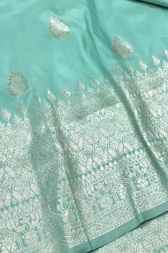 Light blue zari woven banarasi silk blend traditional saree with blouse piece