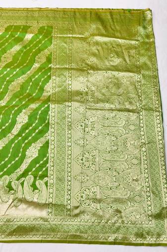 Green zari woven silk blend traditional saree with blouse piece