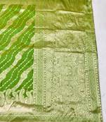 Green zari woven silk blend traditional saree with blouse piece