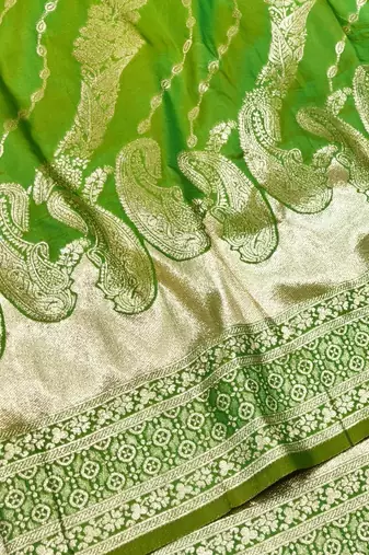 Green zari woven silk blend traditional saree with blouse piece