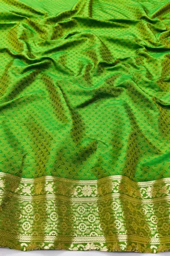 Green zari woven silk blend traditional saree with blouse piece