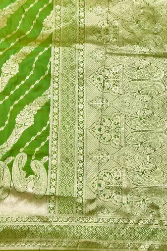 Green zari woven silk blend traditional saree with blouse piece