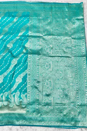 Blue zari woven silk blend traditional saree with blouse piece
