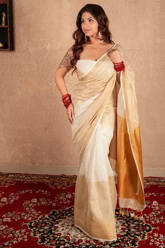 white linen saree with golden border