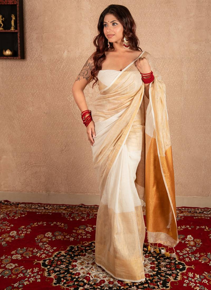 white linen saree with golden border