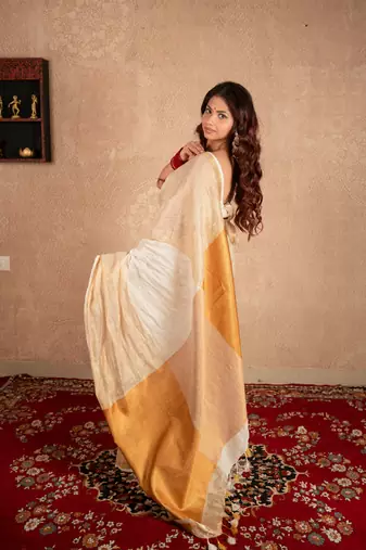 white linen saree with golden border