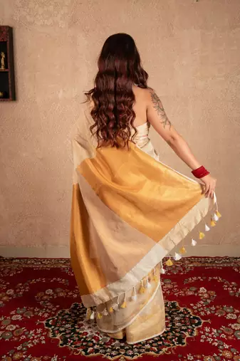 white linen saree with golden border