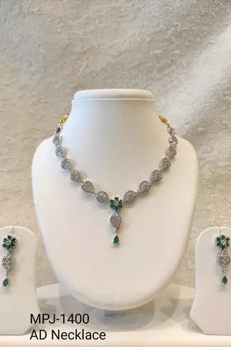 Silver-toned cz and emerald green floral necklace and earrings jewellery set, bridal wear