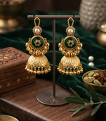 antique gold-plated emerald green jhumka earrings