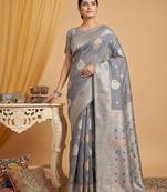 Grey colour linen cotton saree with woven butti & tassel pallu