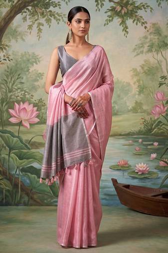 Light pink colour tissue silk saree with silver grey pallu & tassels