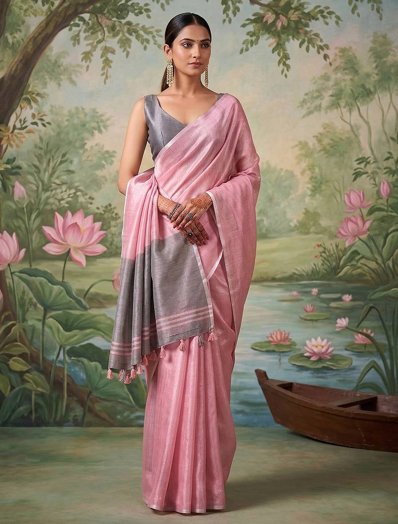 Light pink colour tissue silk saree with silver grey pallu & tassels