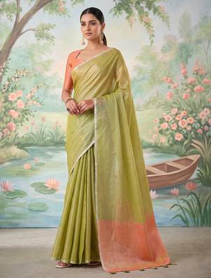 Green colour tissue silk saree with silver grey pallu & tassels 1
