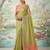 Green colour tissue silk saree with silver grey pallu & tassels