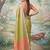 Green colour tissue silk saree with silver grey pallu & tassels