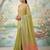 Green colour tissue silk saree with silver grey pallu & tassels