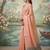 Peach colour tissue silk saree with silver grey pallu & tassels