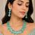 Pista green ad stone rhodium-plated necklace set with earrings