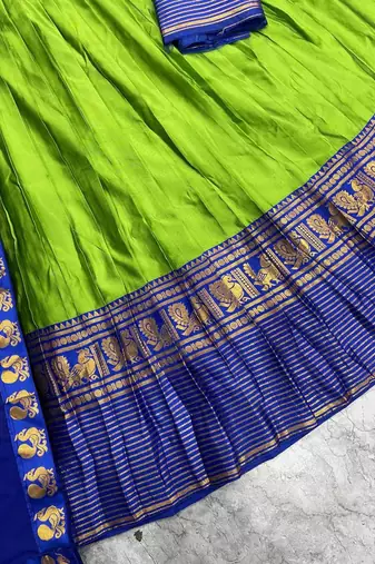 Green kanjivaram silk blend half saree with traditional gold zari weaving work