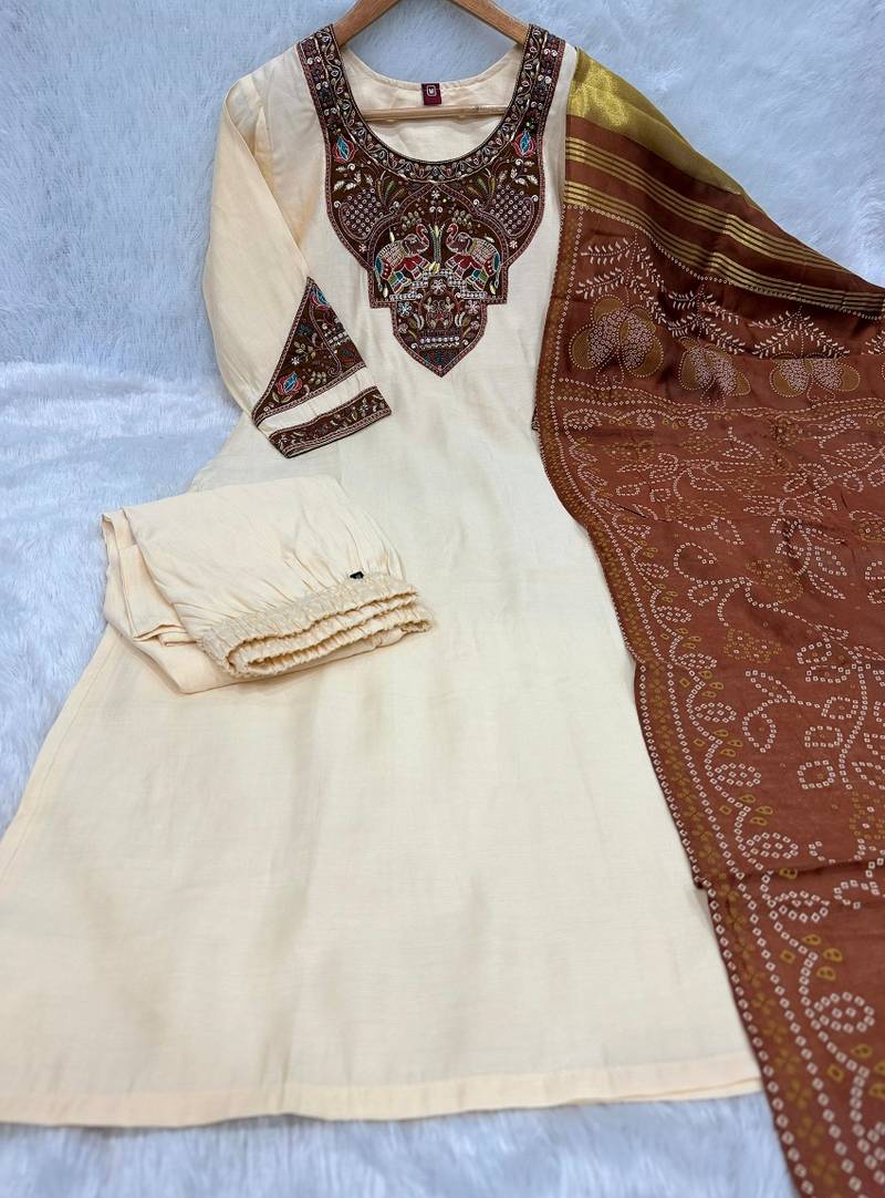 Women cream embroidered straight kurta with rust bandhani dupatta and pant set