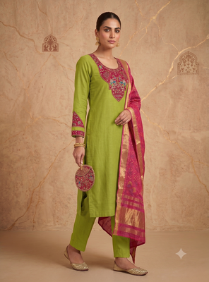 Women lime green embroidered straight kurta with rani pink dupatta and pant set 1